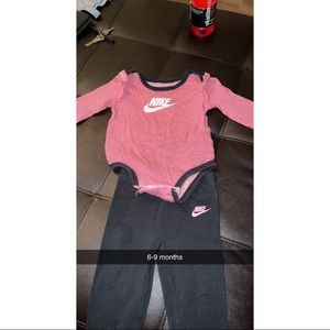 Nike long sleeve onesie with matching pants. Has been worn about 6-7 times.